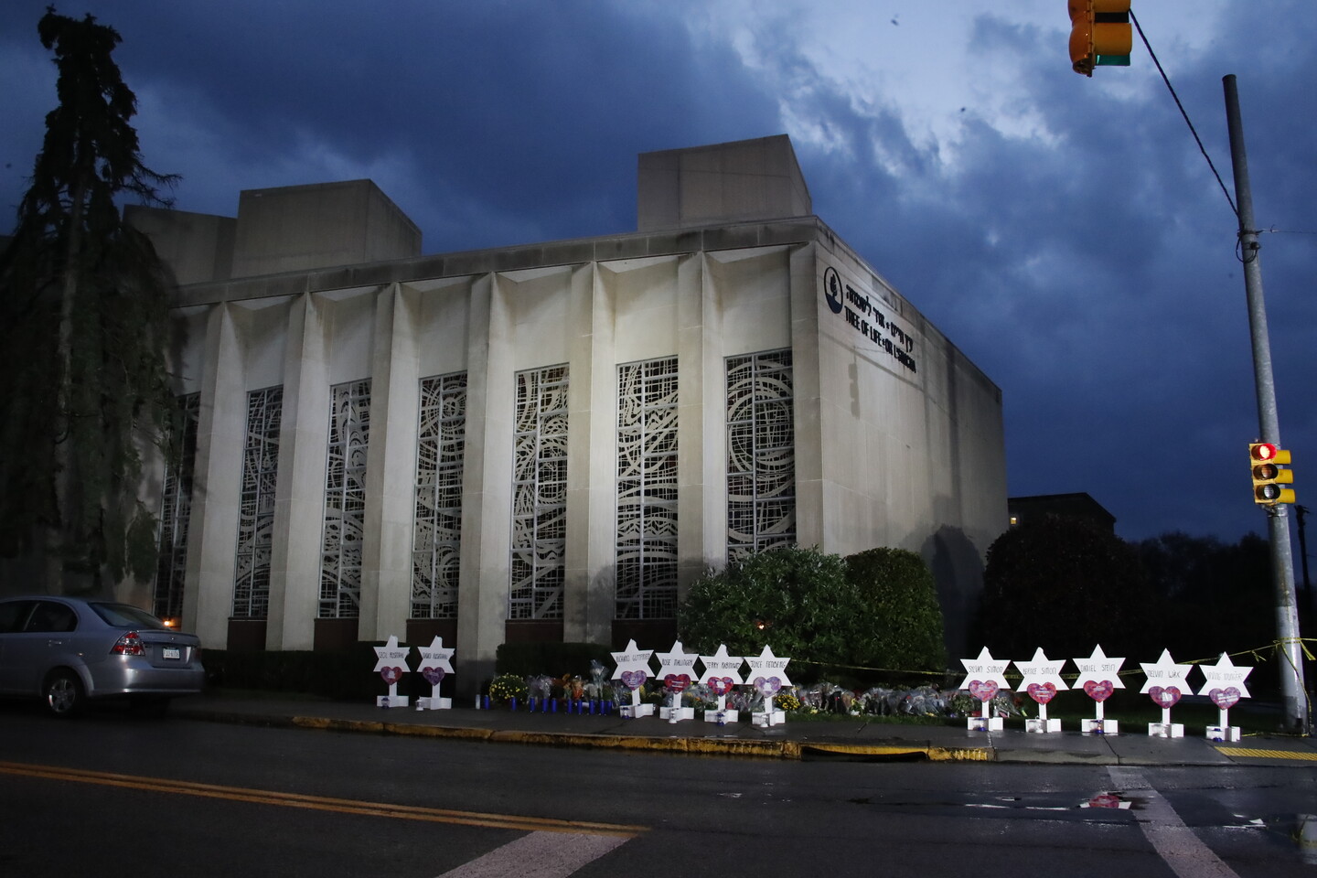 A memorial of flowers and stars line a sidewalk outside the Tree of Life Synagogue in Pittsburgh, on Oct. 28, 2018.