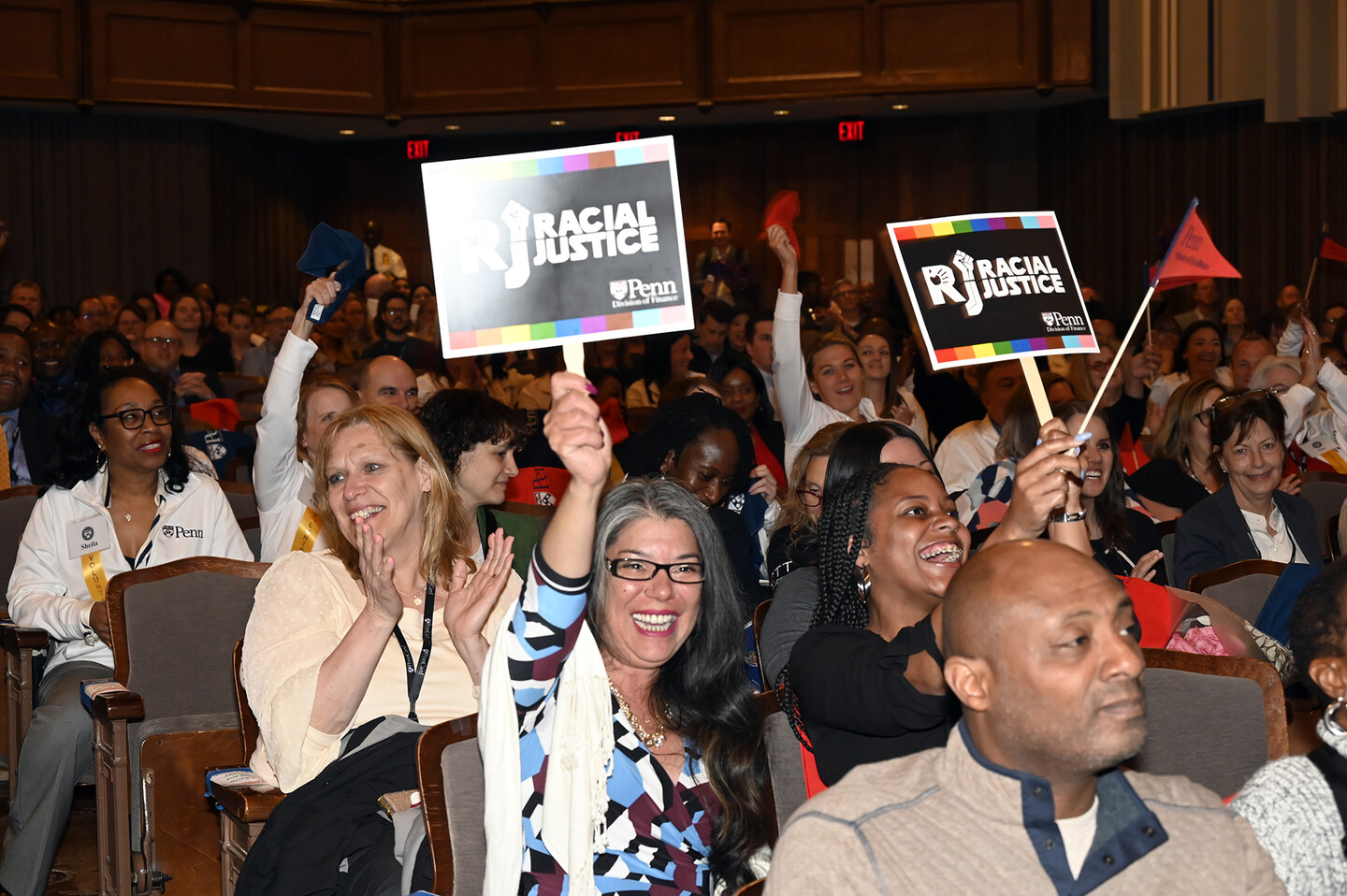 Members of the audience cheer at the Models of Excellence celebration.
