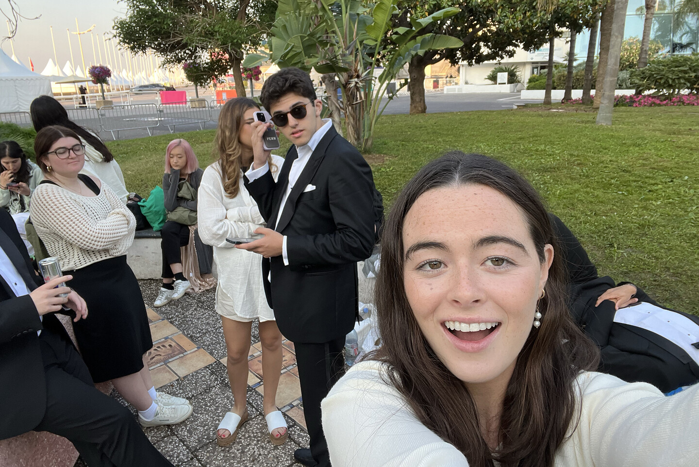 Isabel Sweeney taking a selfie with other students in line