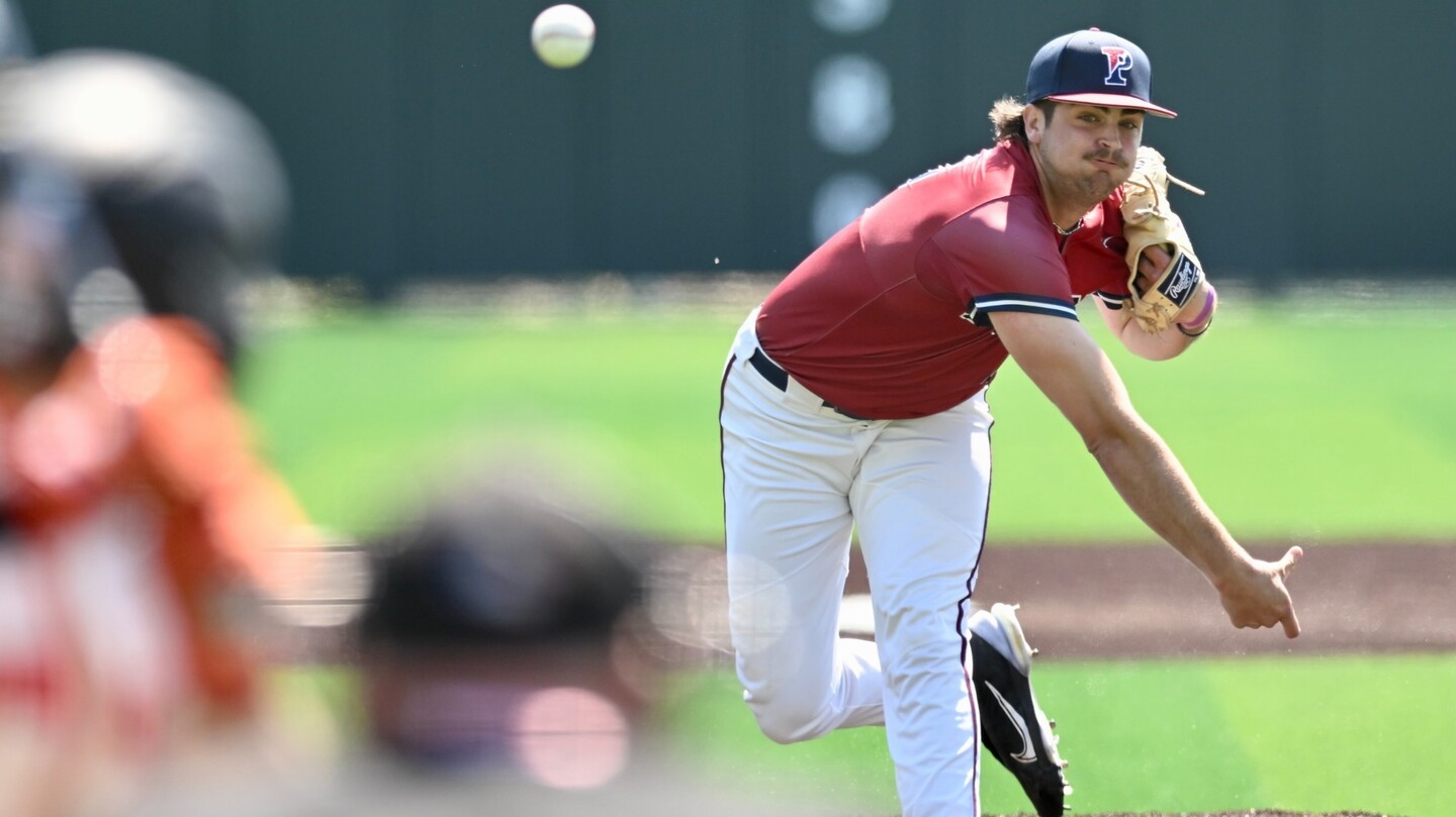 Ryan Dromboski throws a pitch from the mound duirng a game.