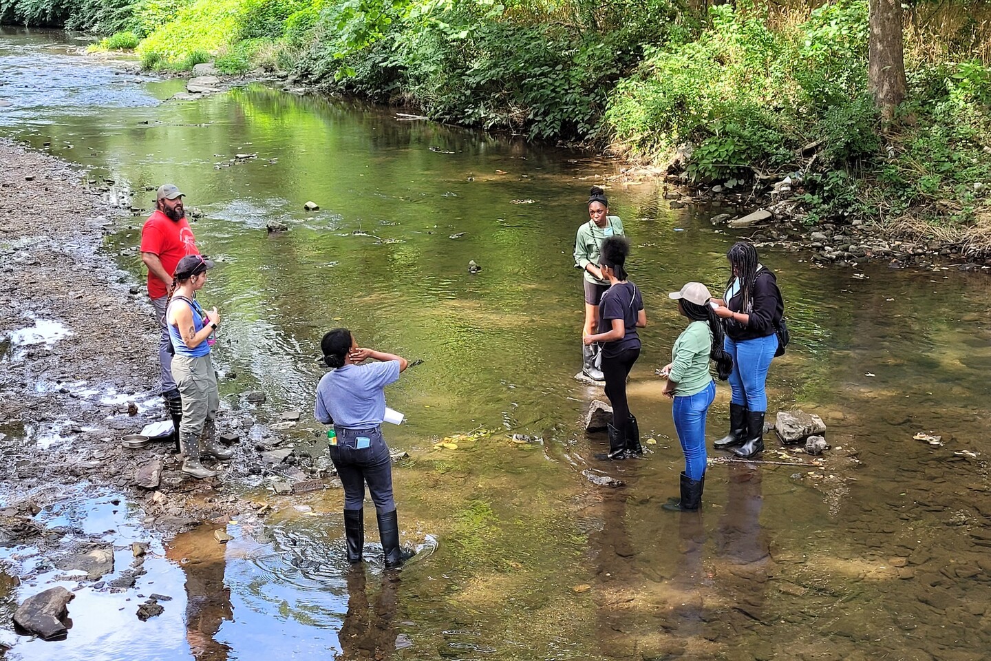 Jazmin Ricks and high school students from Paul Robeson High School at Cobbs Creek.