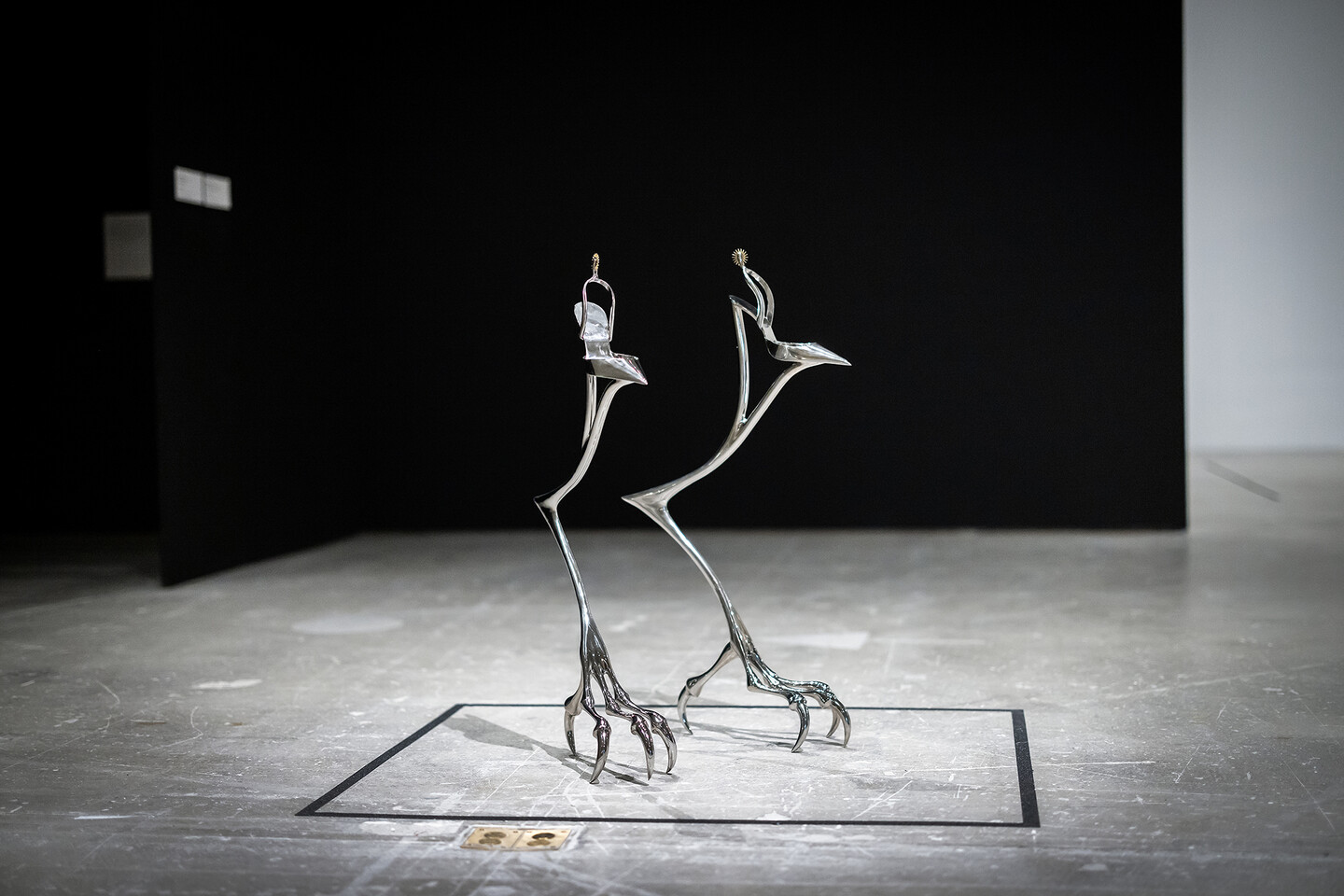 Metal stilts on heels, as sculpture.