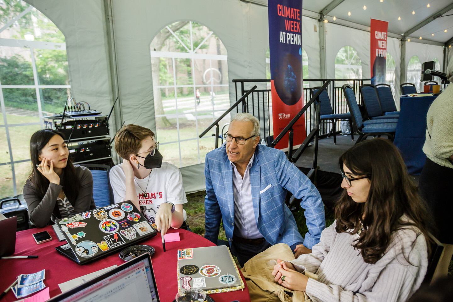 Andrew Hoffman sits with students.