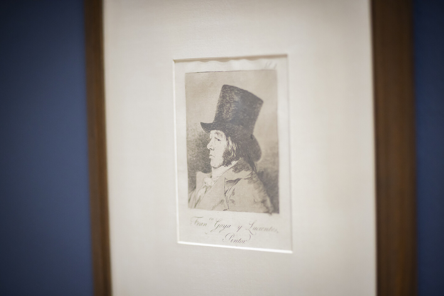 An image of a self-portrait by Goya in a matted frame. 