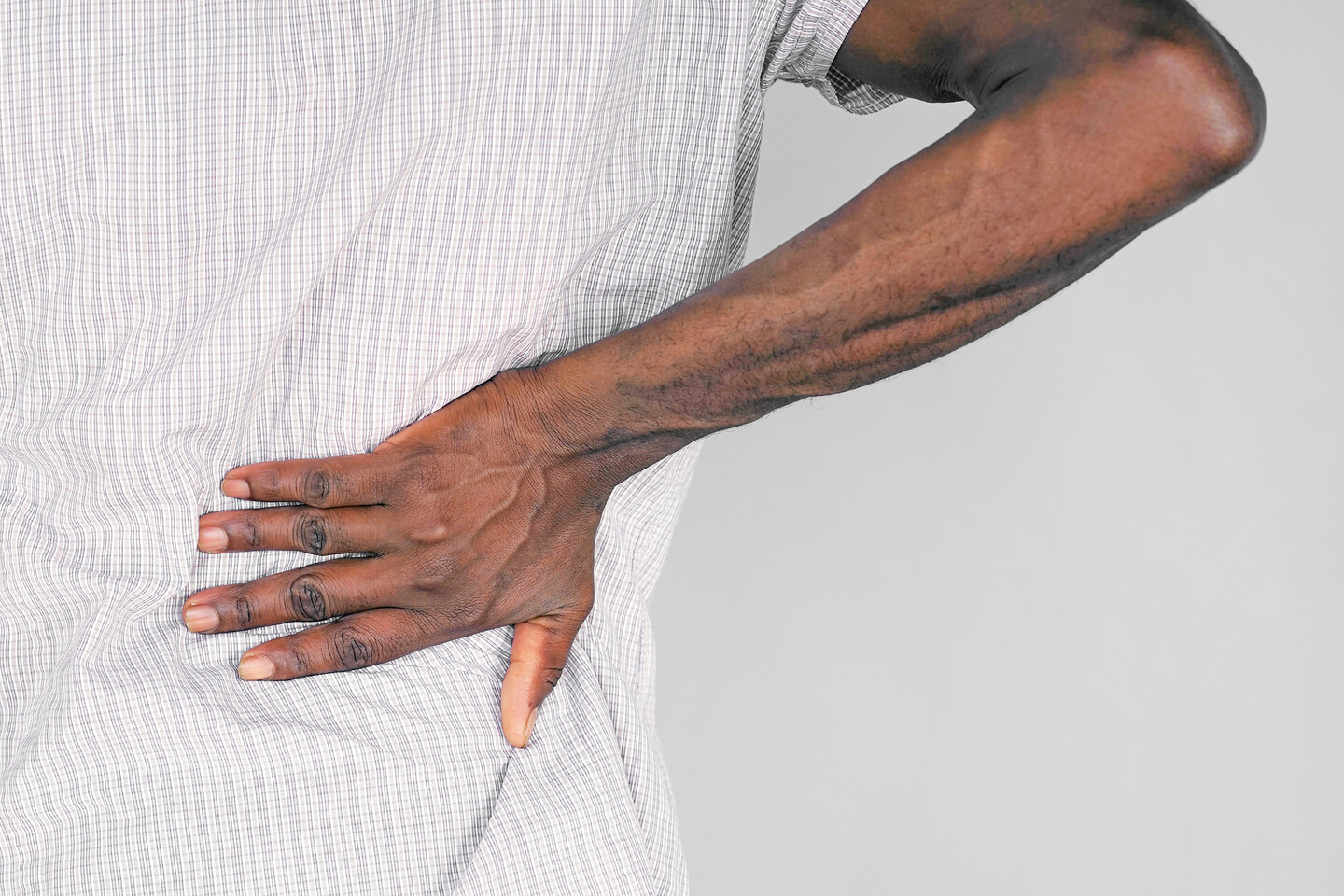 Black man with back pain.