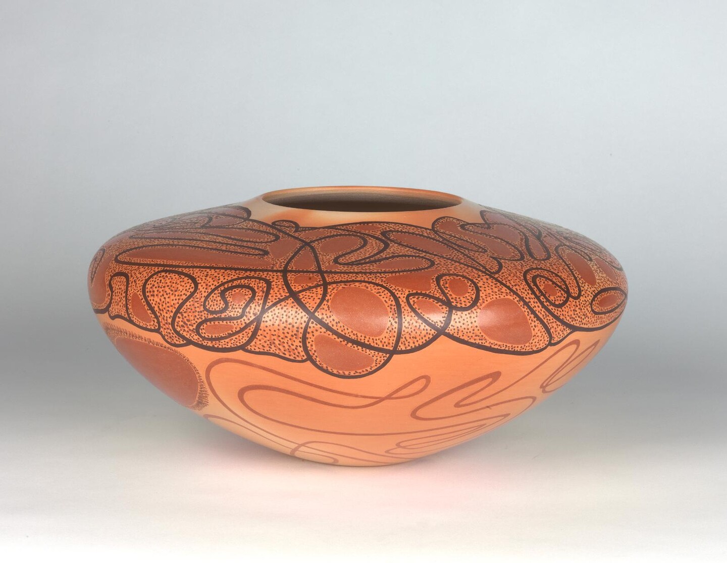 clay jar with dark swirls