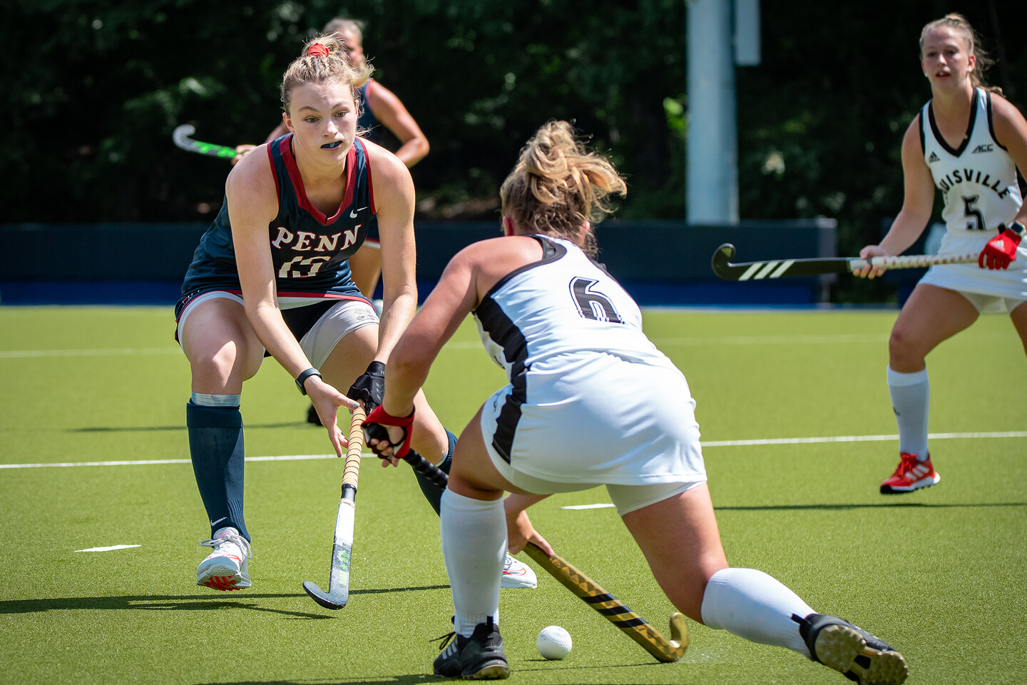 Allison Kuzyk battles for the ball with a Louisville player during a game.