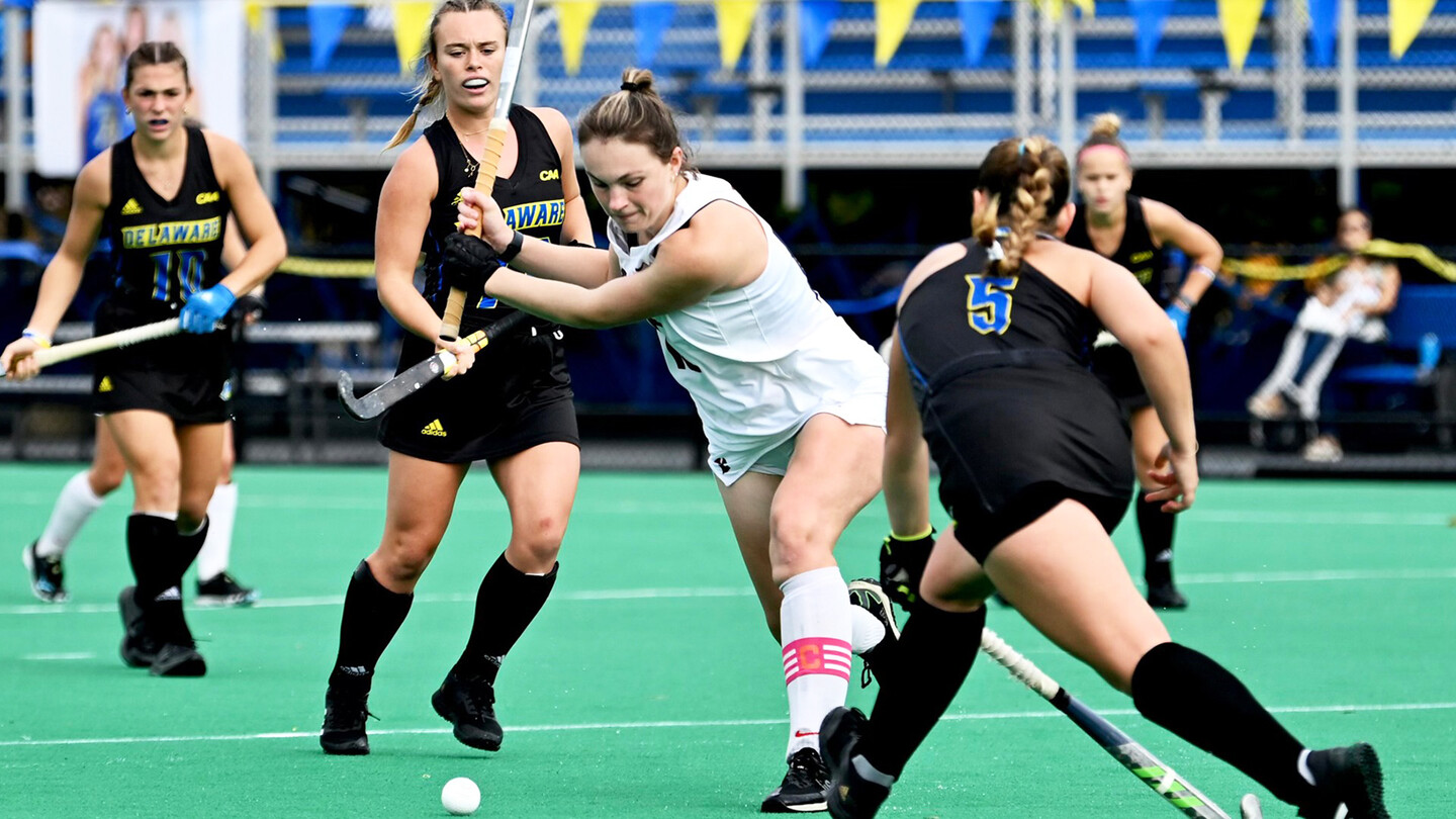 Allison Kuzyk winds up her stick and prepares to hit the ball during a game against Delware.