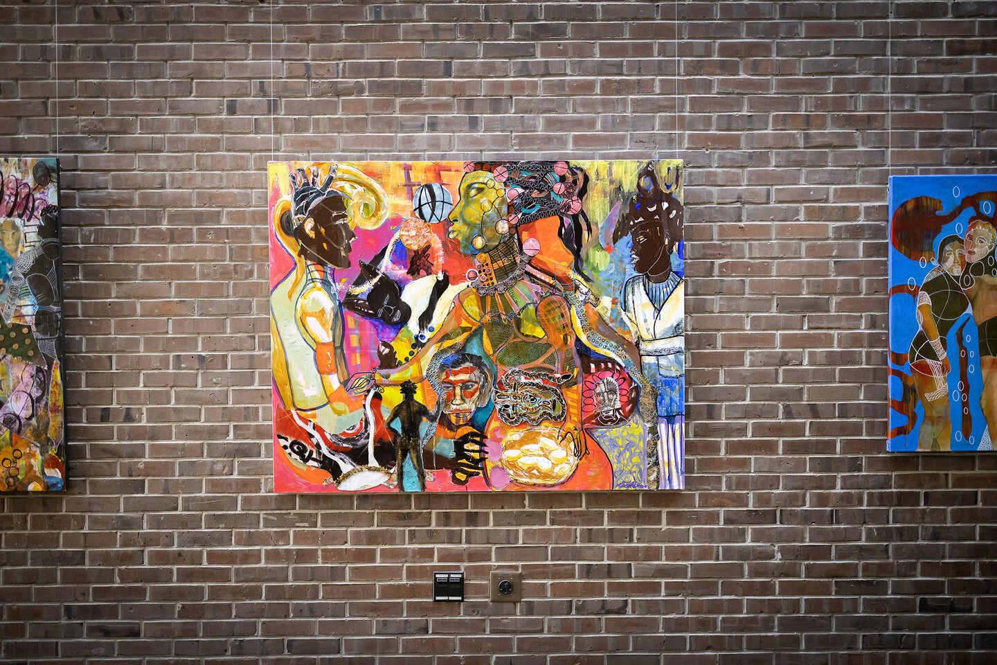 Artwork featuring several distorted silhouettes.