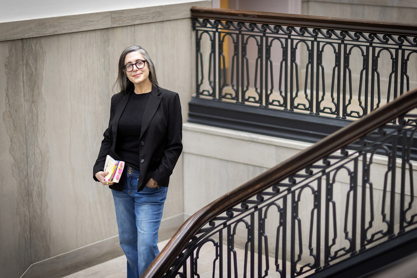 Melissa Jensen standing on a stairway