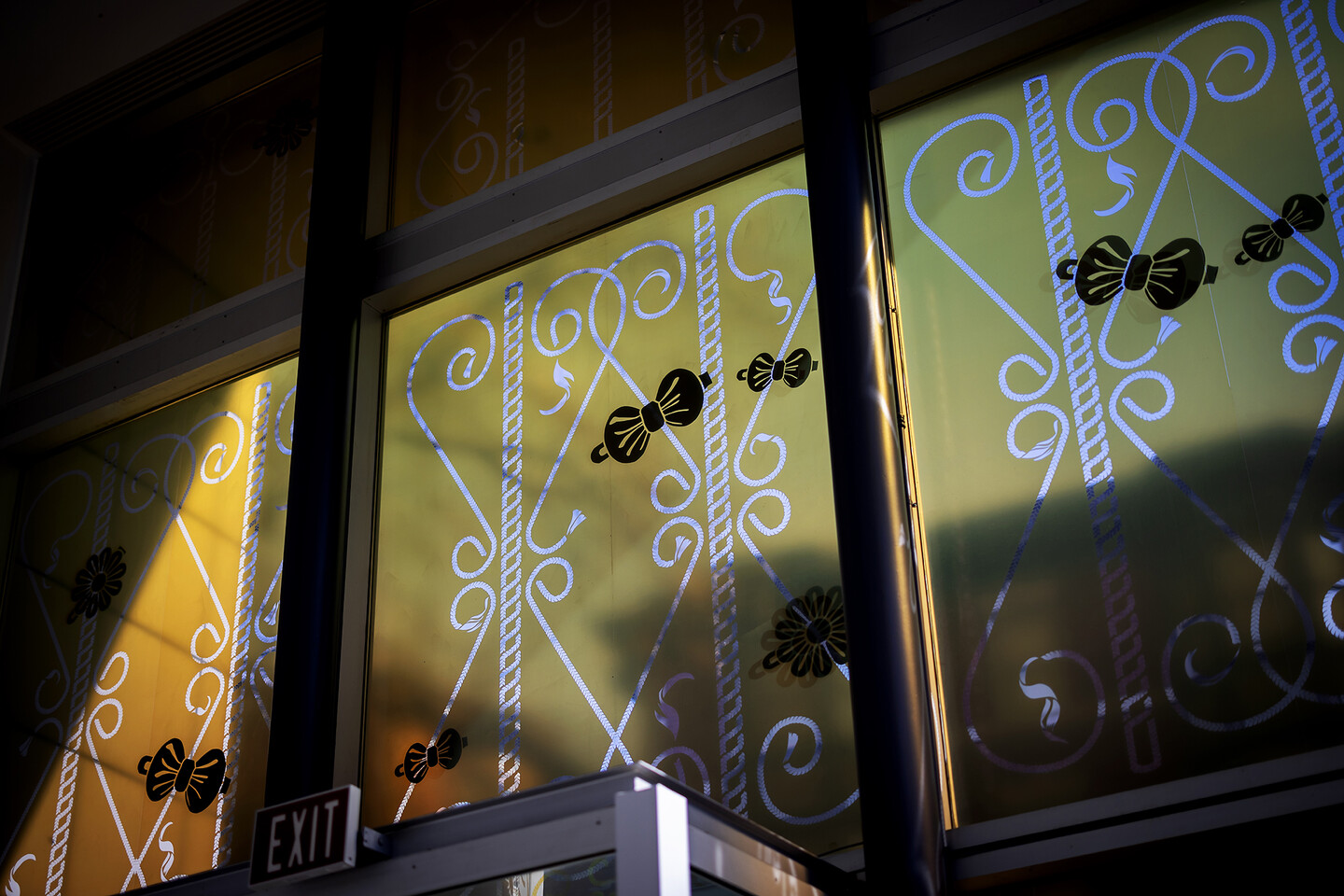 Ornamental braids portrayed through window vinyl. 