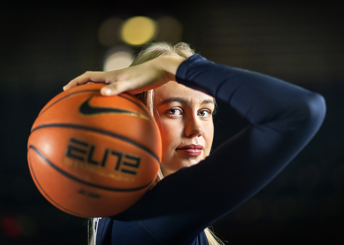 Stina Almqvist holds a ball on her shoulder at the Palestra.