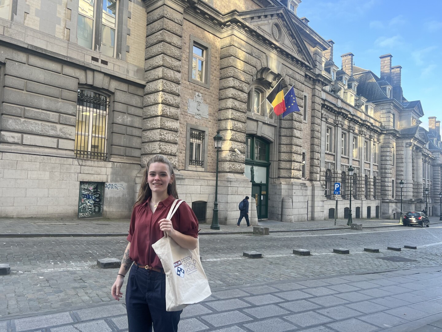 Charlotte Brown in front of Belgium Ministry of Foreign Affairs.
