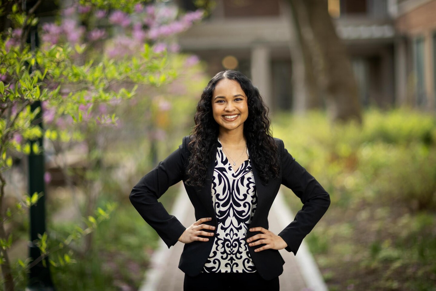 Inaya Zaman standing outside hands on hips