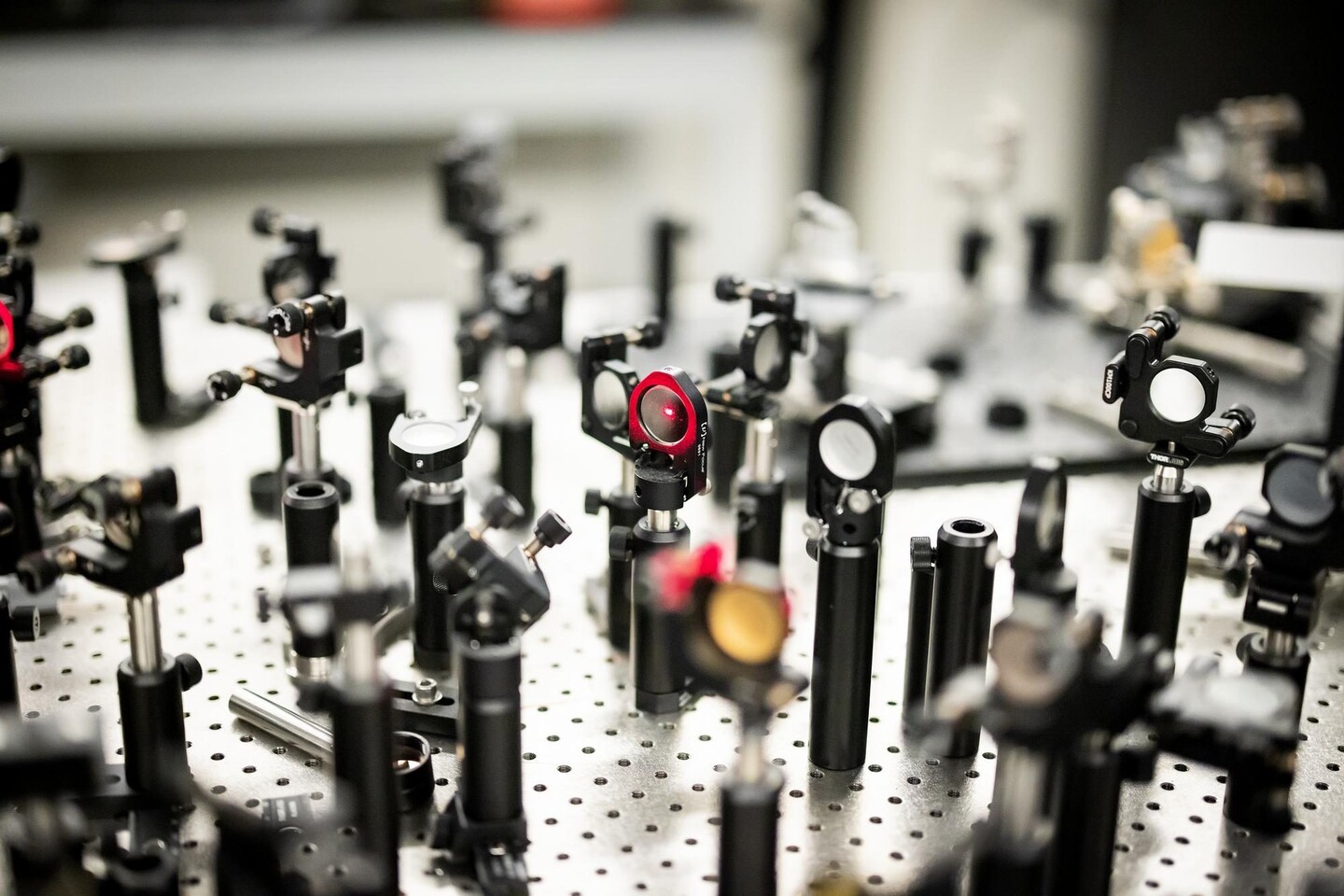 A table with an array of reflectors to direct laser light.