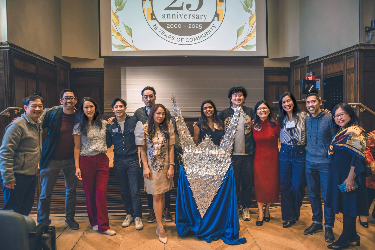 The current PAACH team, founding PAACH student leaders and alumni gather at the anniversary event.