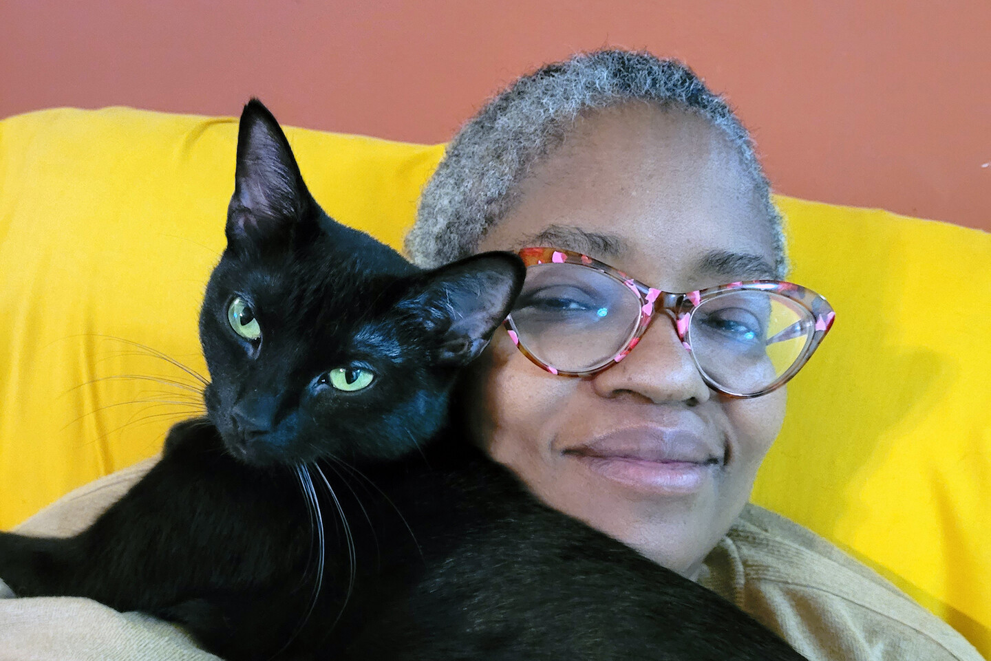 Candace Adams holds cat.