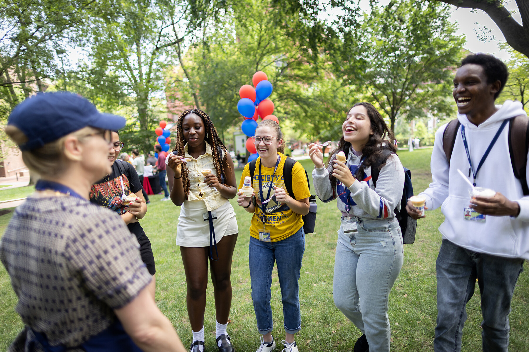 Five students talk with Liz Magill at the Ice Cream Social.