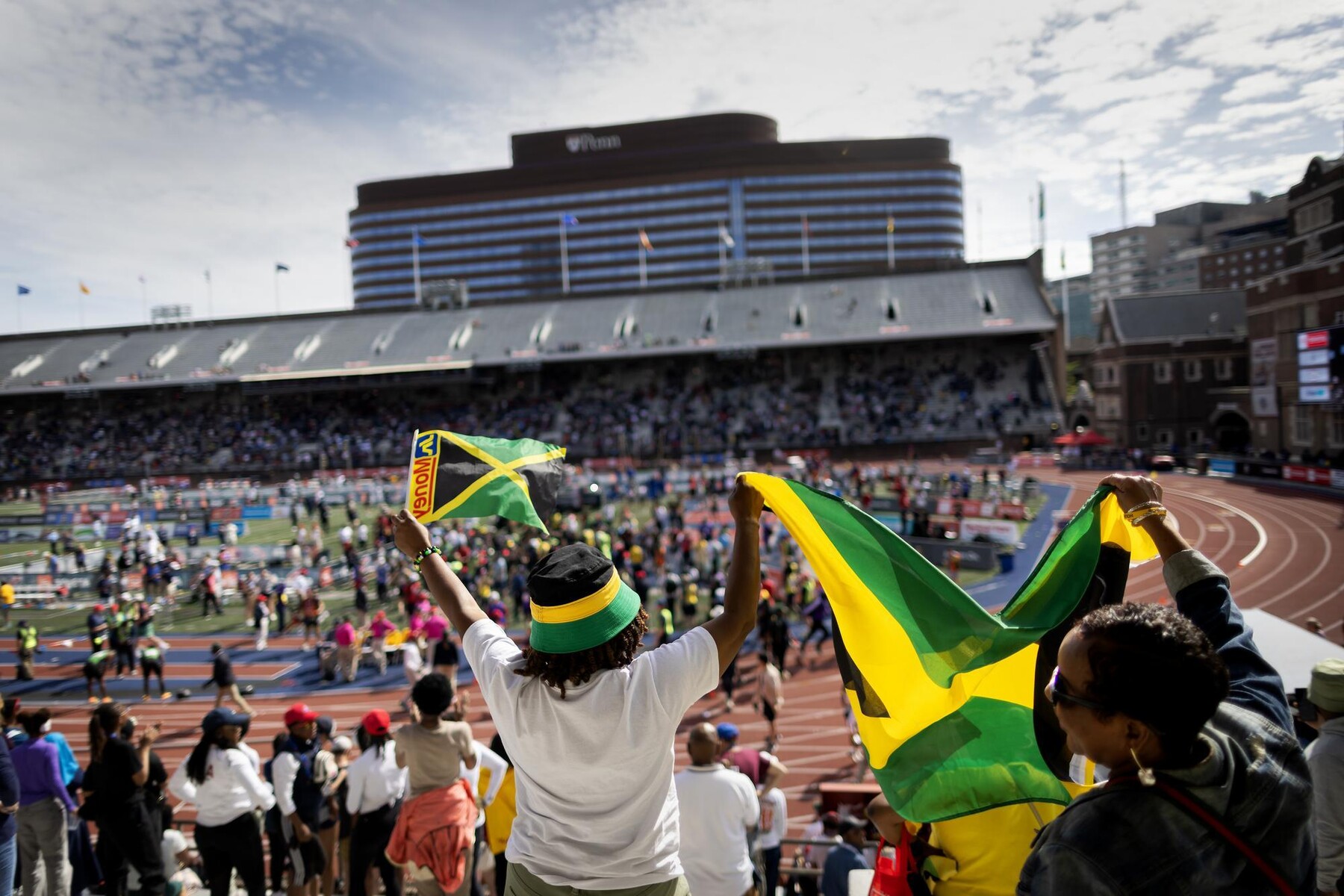 Spectators cheering in the crowd at Franklin Field during the Penn Relays.