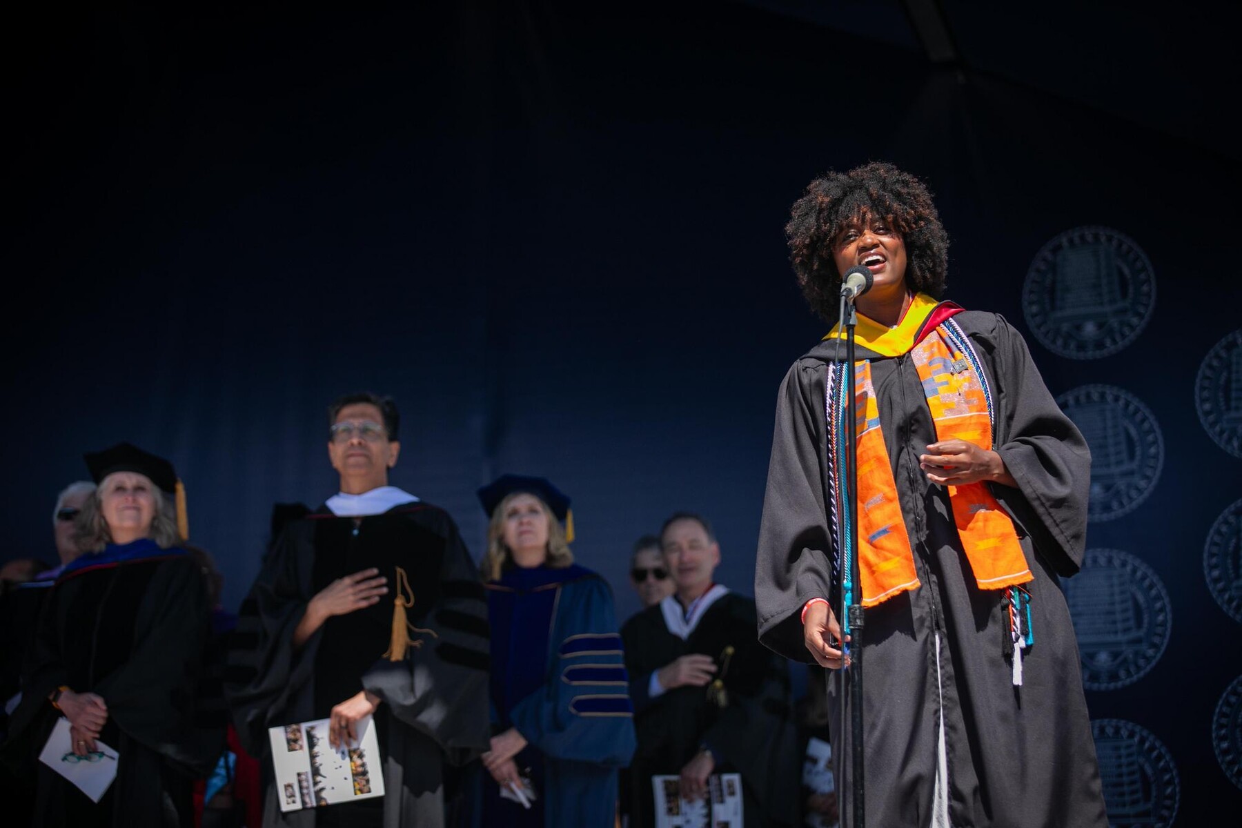 A graduate singing the National Anthem at Penn’s 269th Commencement.