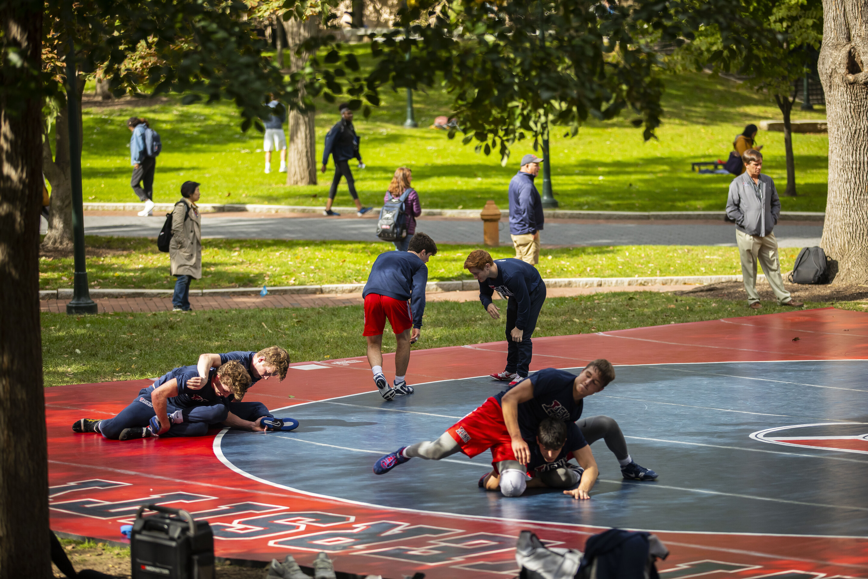 six-wrestling-team-members-practice-outdoors-in-teams