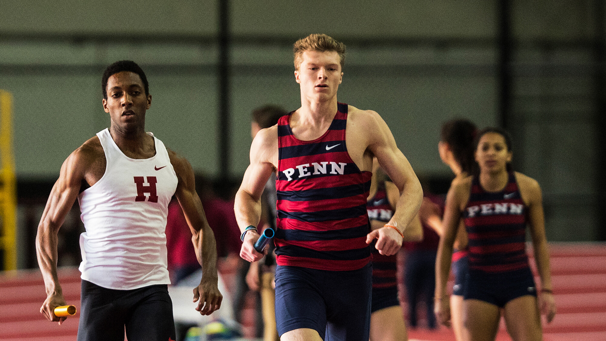 Junior Evan Lee competes at an indoor event.