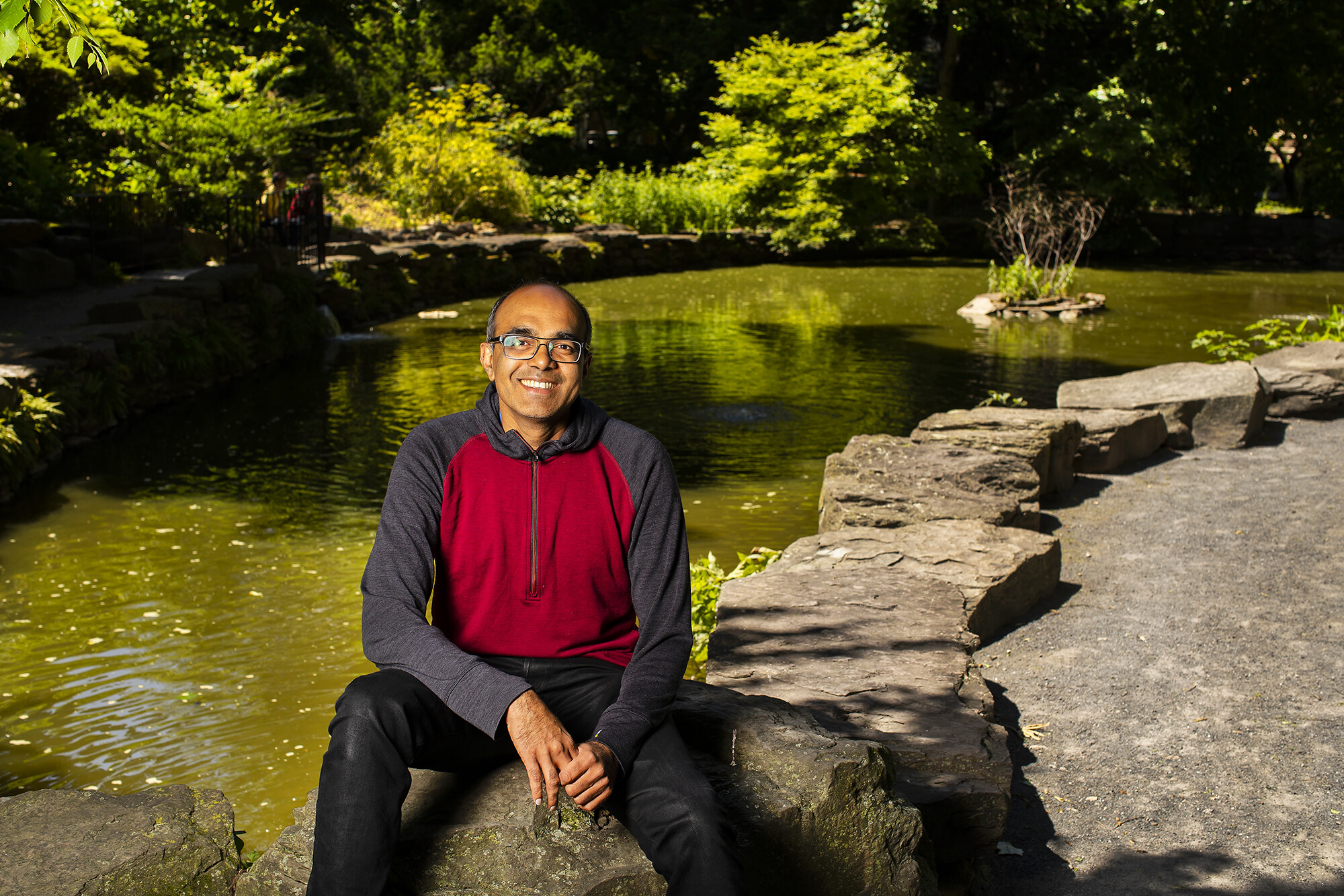 Vijay Balasubramanian sitting next to BioPond
