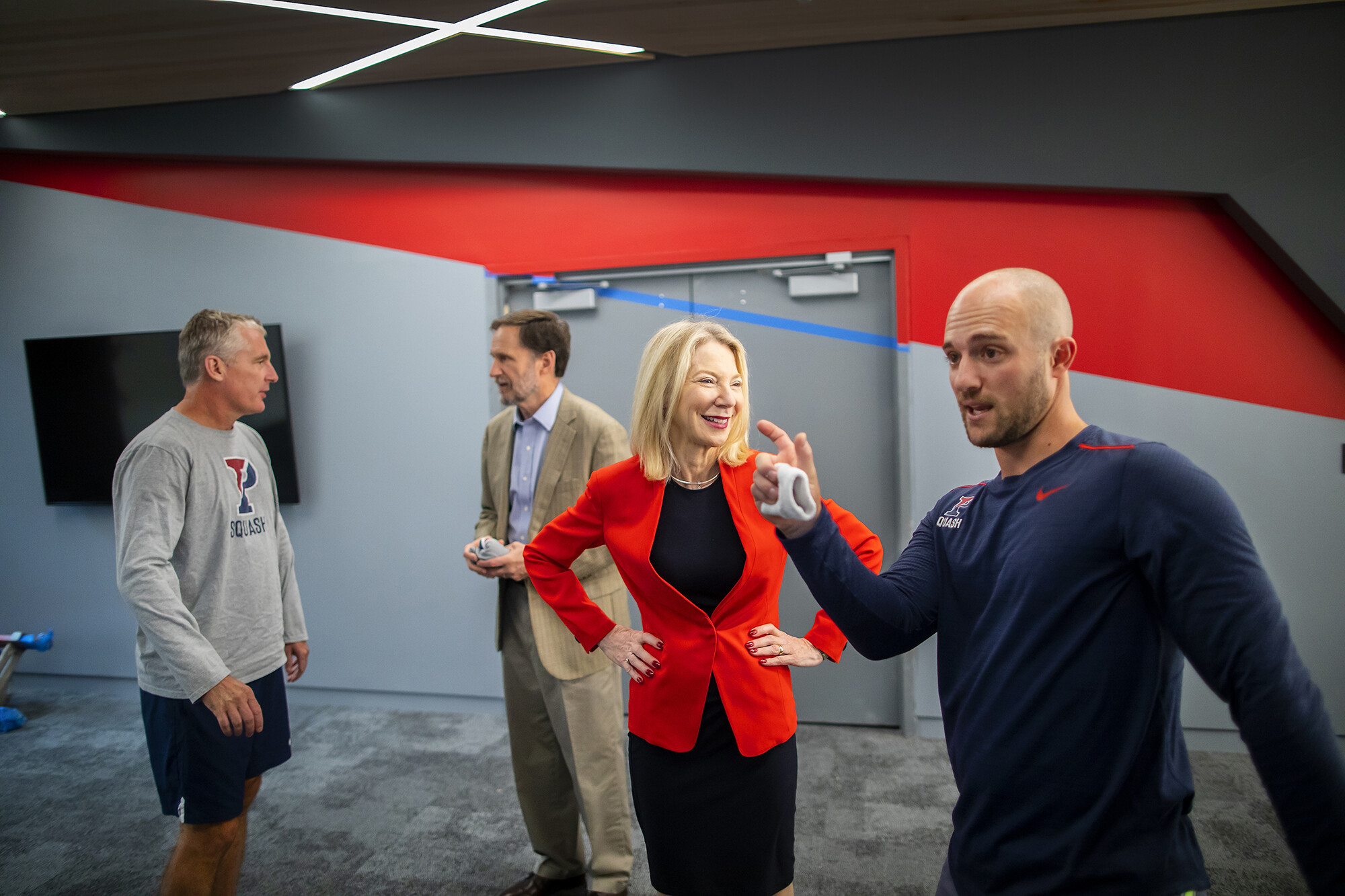 From left, Director of Squash Jack Wyant, Michael Doyle, President Amy Gutmann, and Gilly Lane.