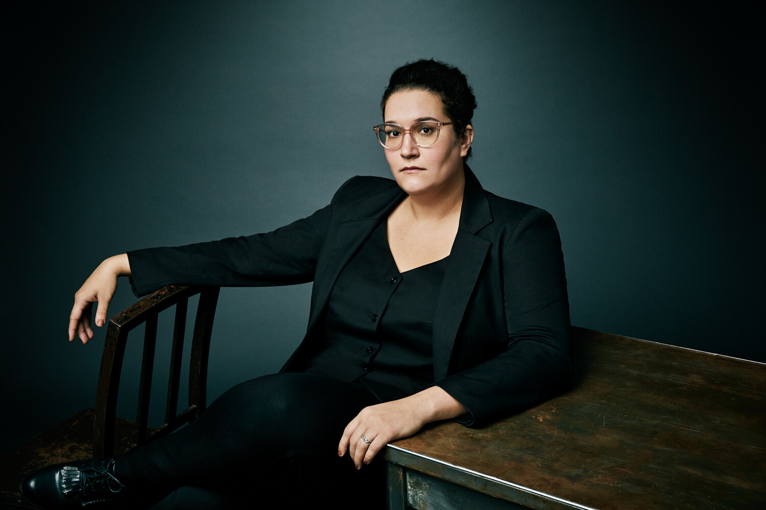 carmen machado seated at a table