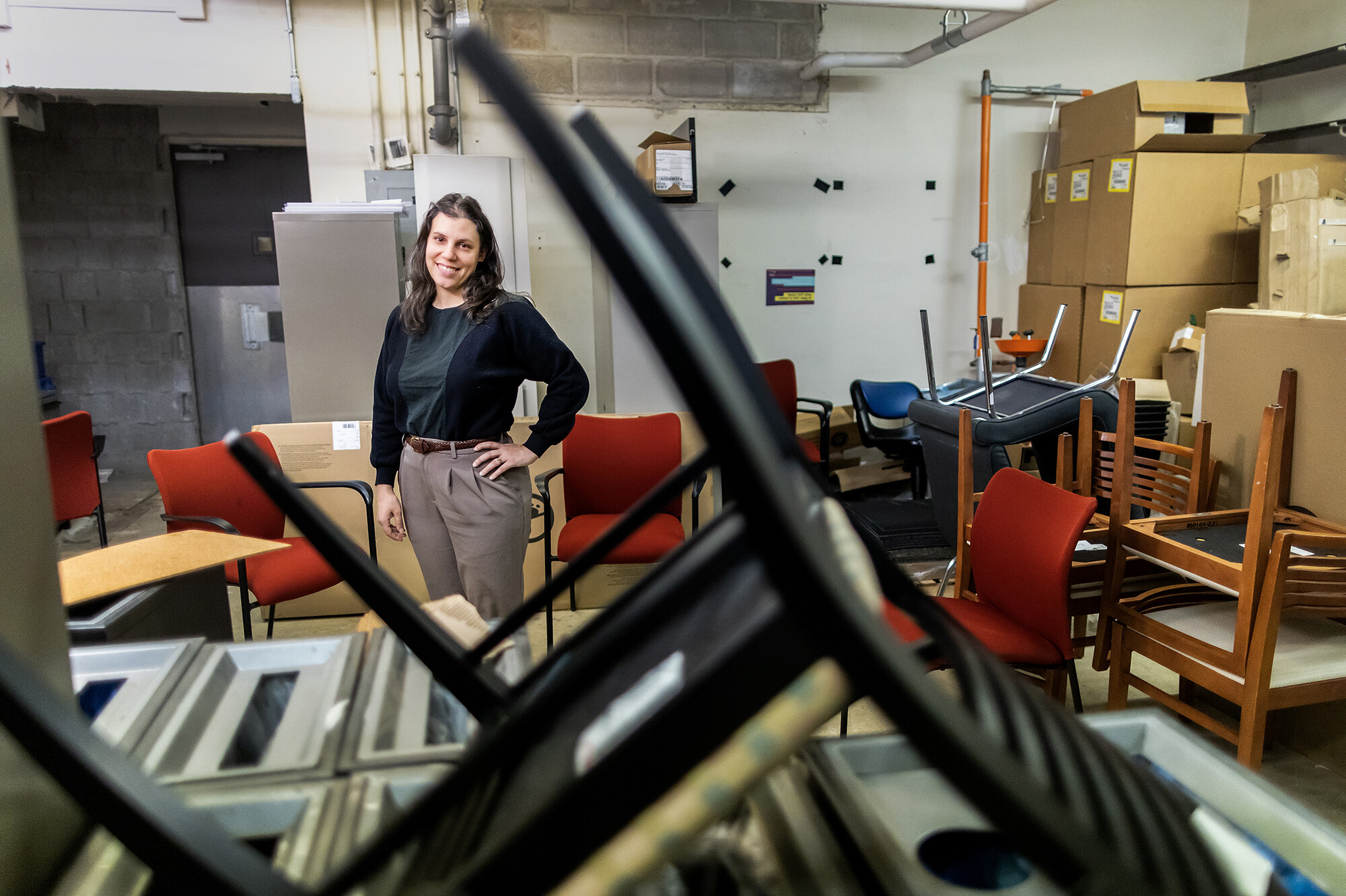 Danielle Cavalcanto surrounded by furniture.