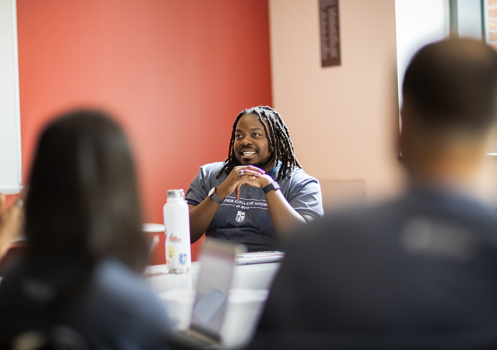 mitchell holtson sitting at a table in lauder