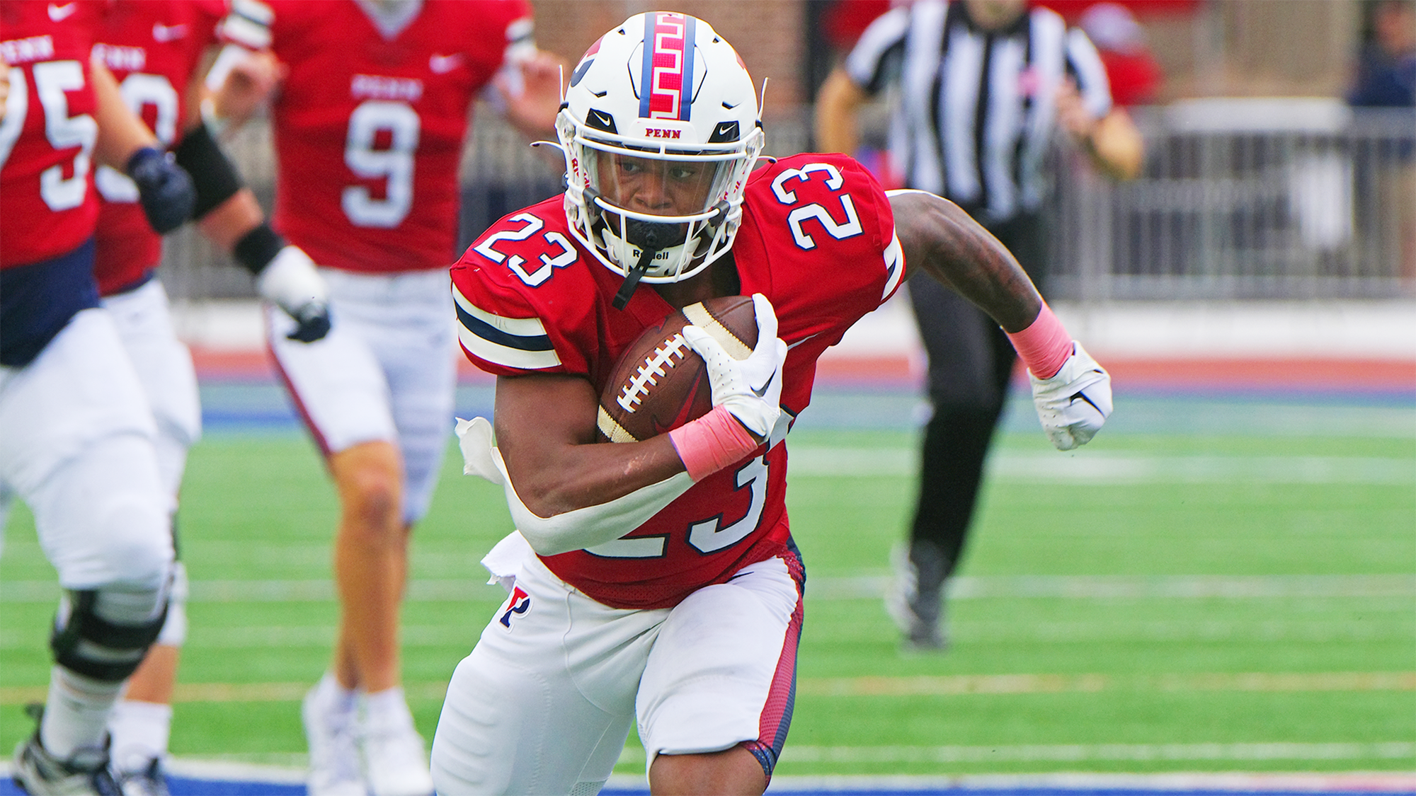 Malachi Hosley runs with the ball during a game.