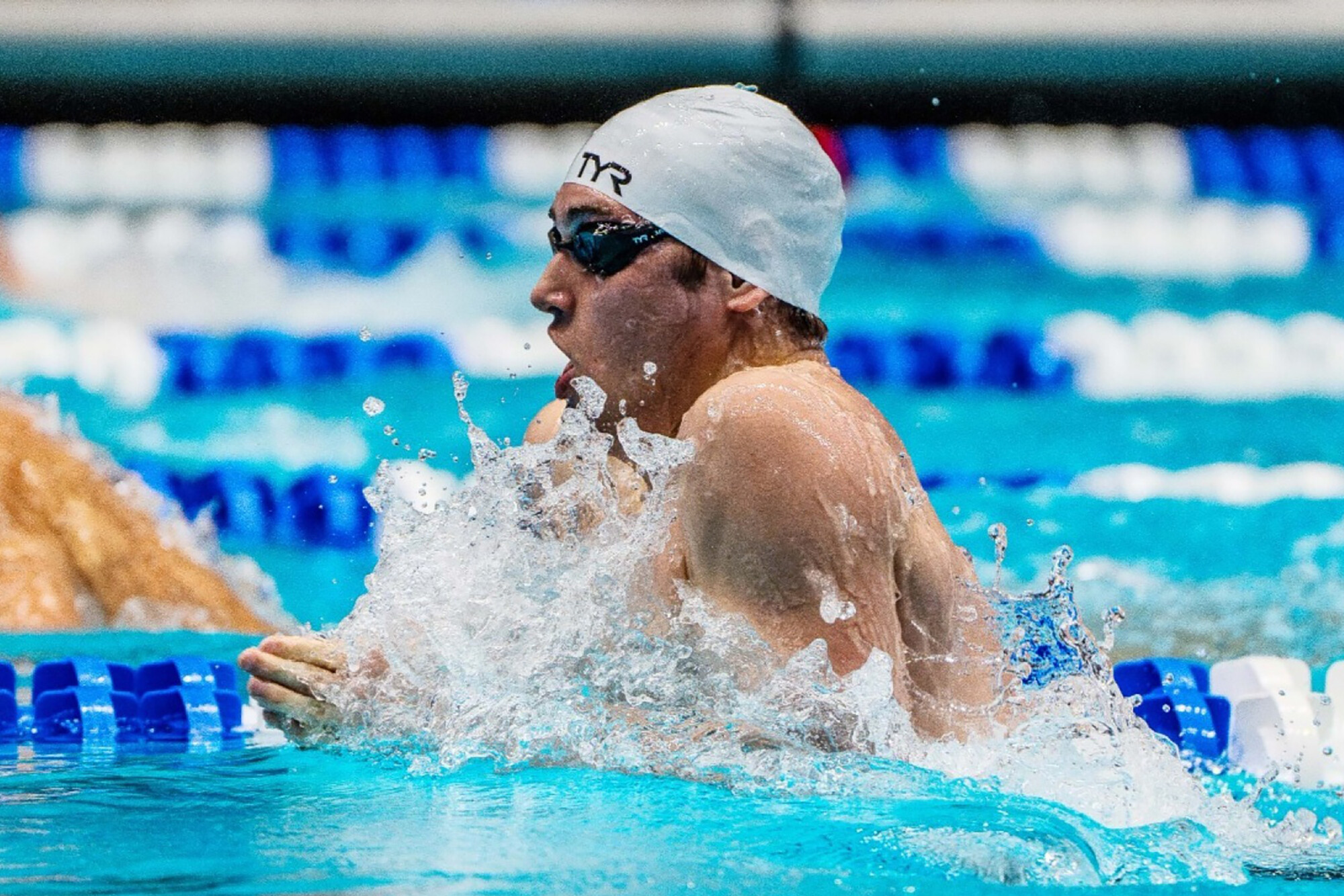Matthew Fallon swimming in a pool.