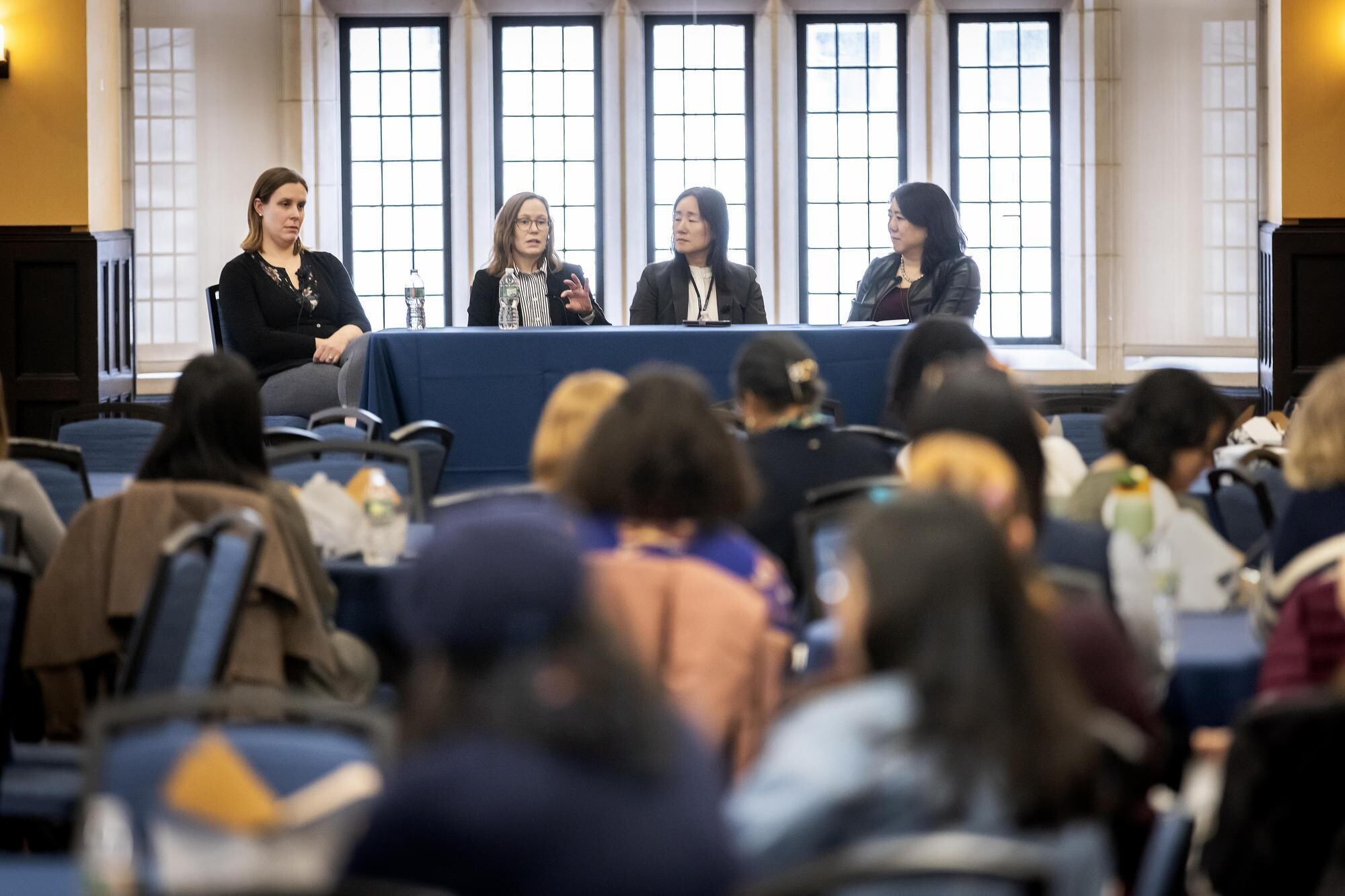 Allyson Mackey, Melissa Kelly, Ping Wang, and Vanessa Chan speaking to audience.