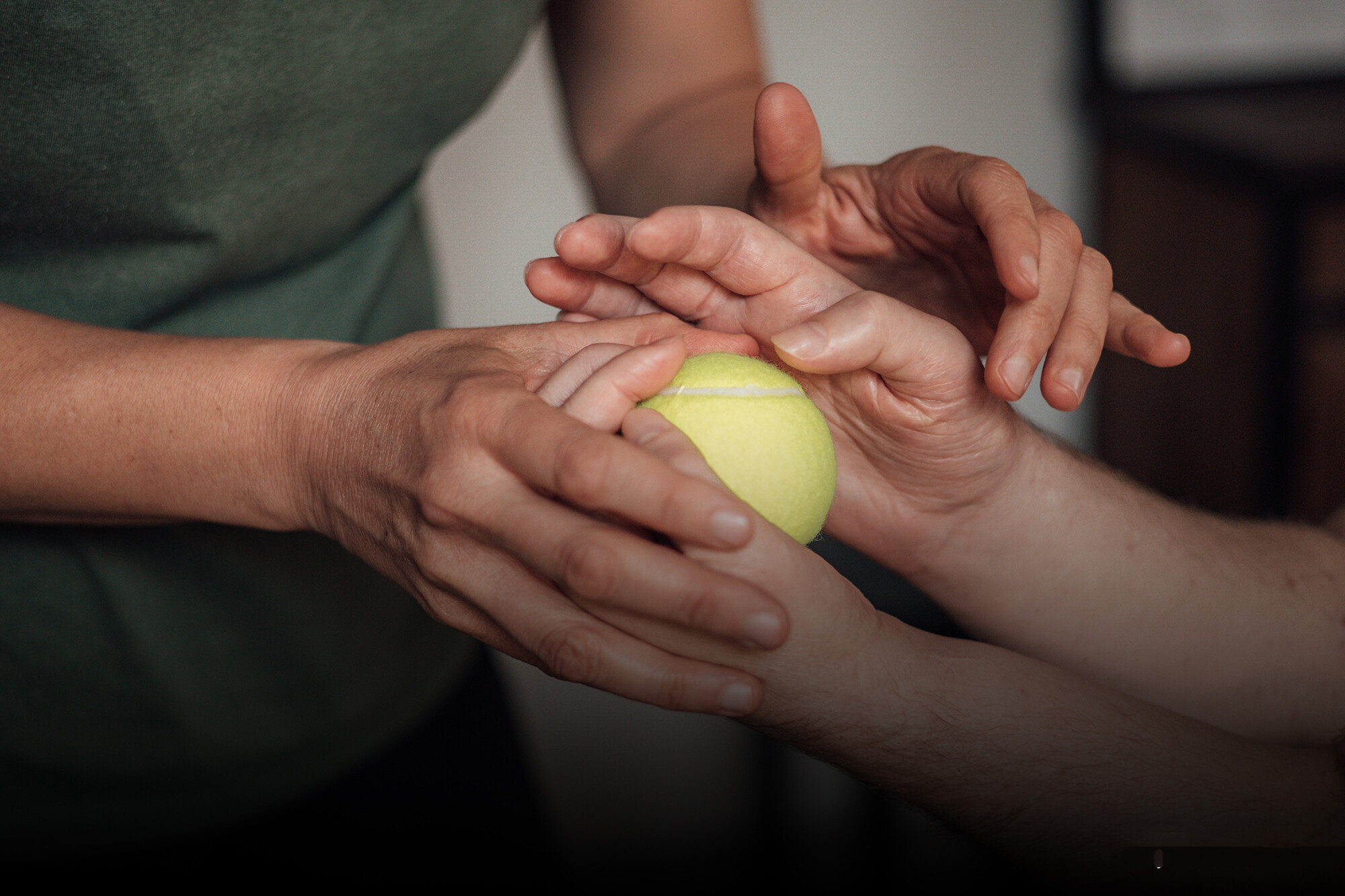 Luka Krizanac holding a tennis ball.