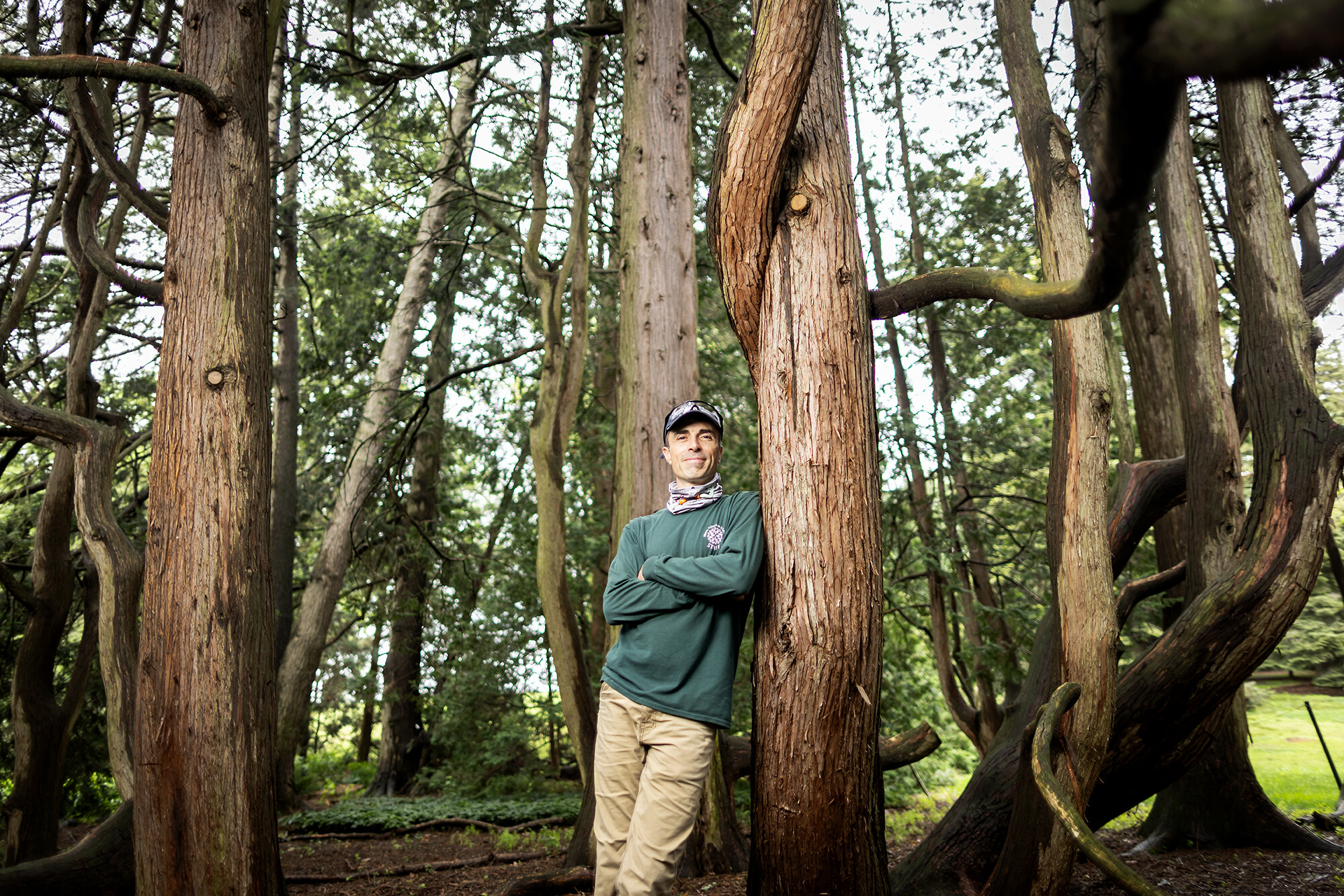 Peter Fixler leans against a tree at the Morris Arboretu.