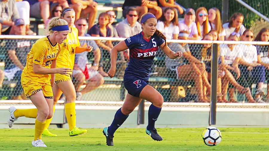 Emily Sands dribbles the ball against La Salle