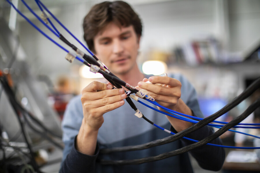 student on blast team working on cables