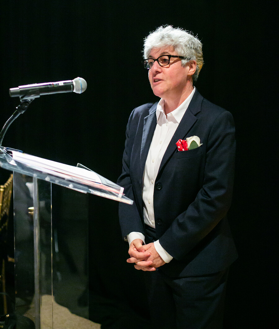 constantia speaking at a podium