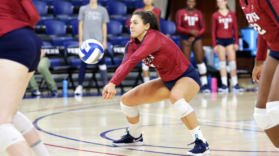 Parker Jones digs a volleyball at the Palestra.