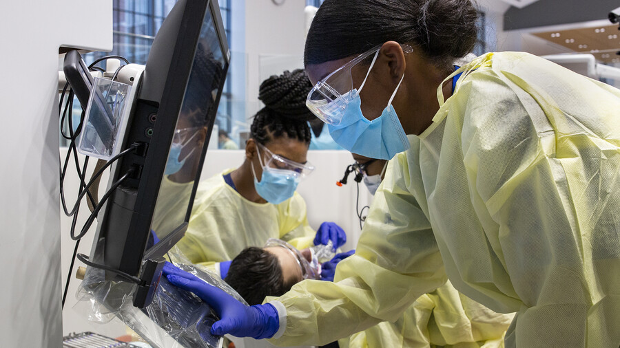 penn dental students looking at a screen during exam