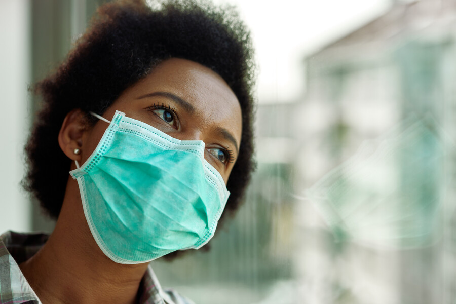 african american person wearing a mask
