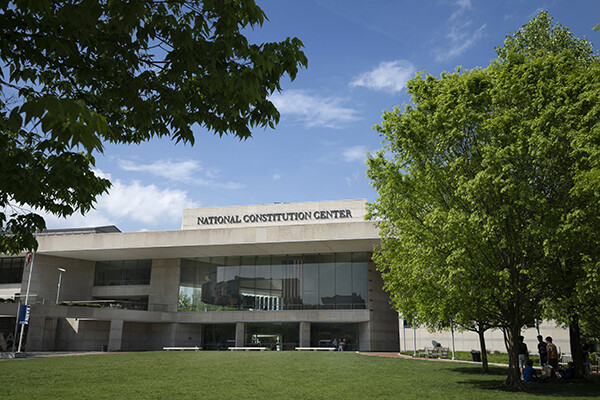 Building surrounded by trees and a lawn