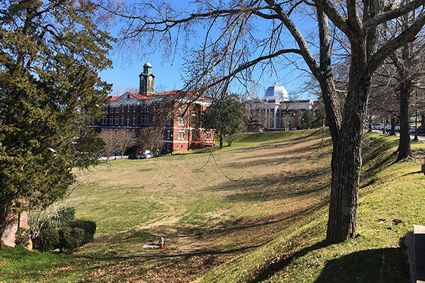 A building at Tuskegee University on a green hill in daylight.