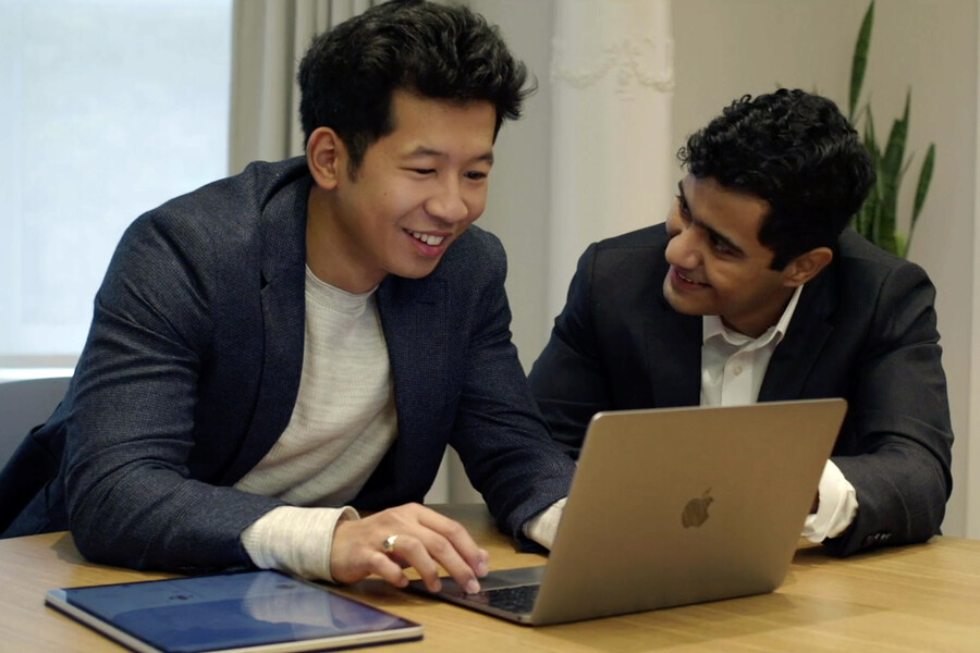 Aris Saxena and Yiwen Li working on their laptop
