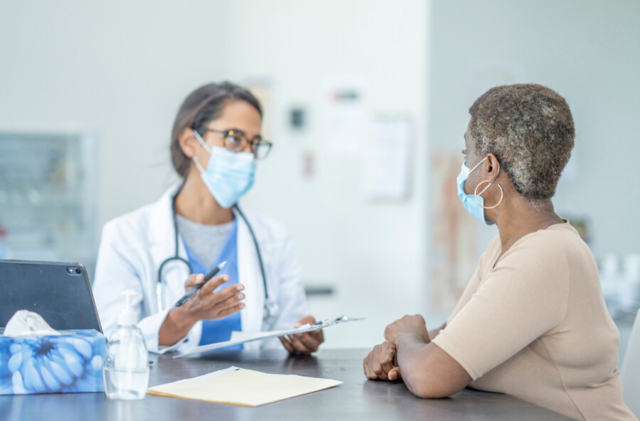 A doctor talking with a patient.