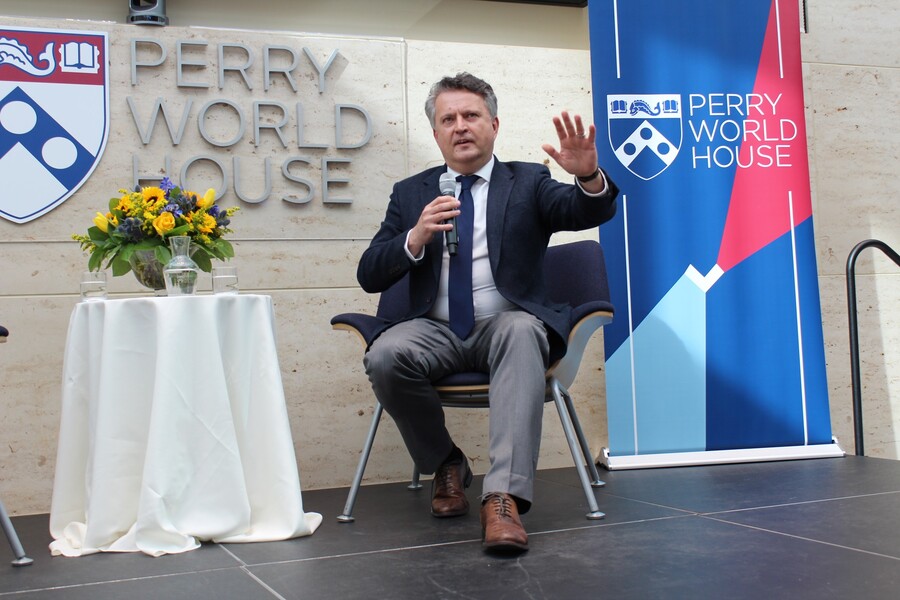 person sitting on stage talking 