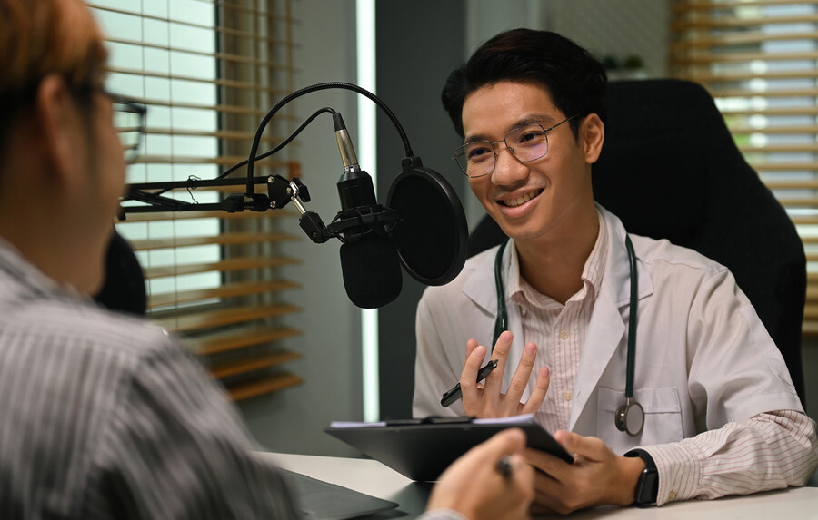 A doctor being interviewed for a podcast.