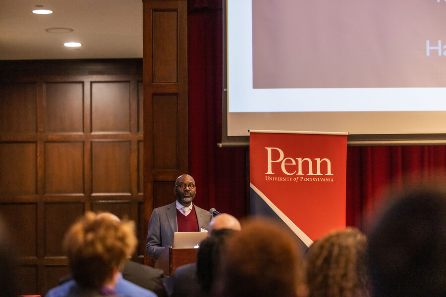 John L. Jackson Jr. at the podium in Houston Hall’s Hall of Flags.