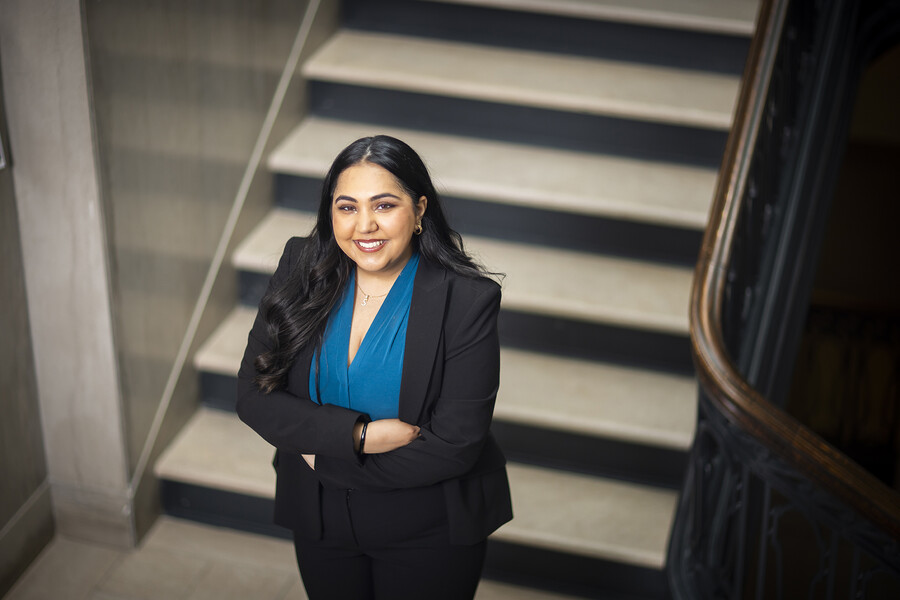 Penn fourth-year Simran Rajpal stands in a hallway in Fisher-Bennett Hall on Penn campus.